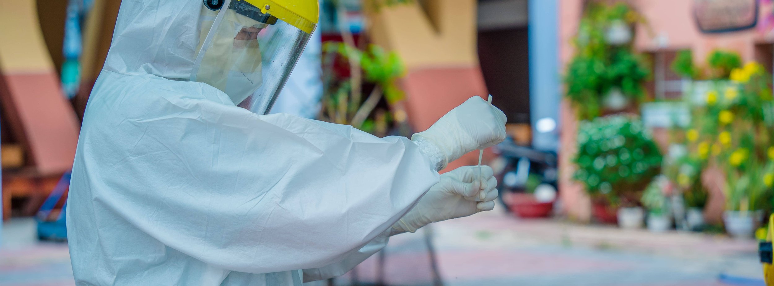 Technician disinfecting interior surfaces