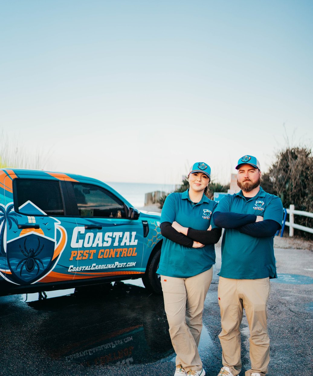 Pest control technician treating wall cavity